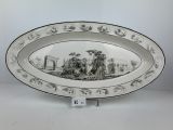 an oval platter with a scene of a farm scene on it