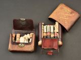 a box of cigarettes and a case of cigarettes on a table
