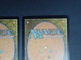 two decks of magic the gathering are shown on a table