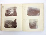 an old photo of a book opened to show pictures of mountains