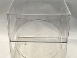a clear box with a clear lid on a white surface