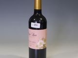 a bottle of wine that is sitting on a table
