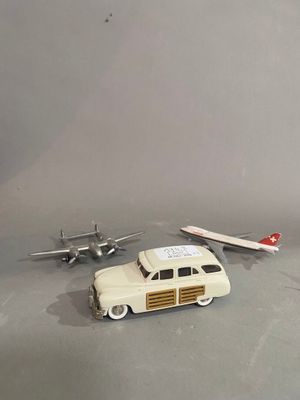 a toy car and a toy plane on a table