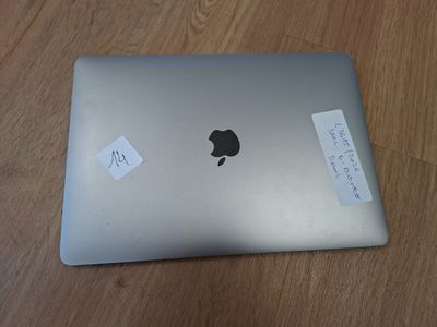 an apple macbook pro laptop sitting on top of a wooden table