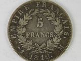 an old five cents coin with a wreath of leaves on it