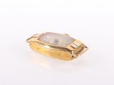 an image of a gold ring with a white stone in the center