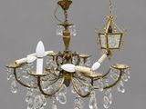 a chandelier hanging from a pole with a bird on it