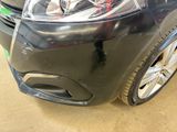 a close up of a car ' s headlight and front bumper