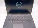 the dell laptop is open and ready to be used
