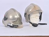 two helmets that are sitting on top of a table