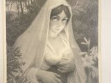 une vieille photo d'une femme tenant un bébé dans ses bras