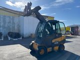 a picture of a forklift truck parked in front of a building