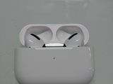 a white apple airpods sitting on top of a table