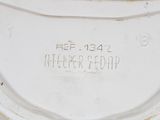 a close up of a clock on a white surface