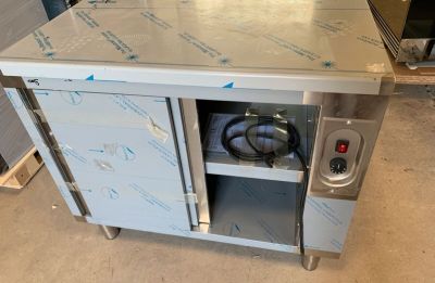 an image of a stainless steel kitchen island with a stove