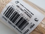a close up of a barcode on a wooden stick