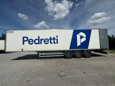 a semi truck that is parked in a parking lot