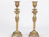 pair of antique brass candlesticks with female figures on pedestals