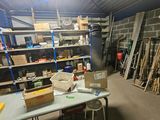 a room with a table and shelves full of items