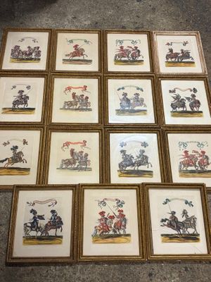 many framed pictures of horses and riders on the floor