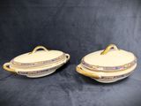 a pair of yellow dishes with floral designs on them