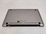 a laptop that is sitting on a white surface