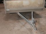 an image of a trailer in a garage with other vehicles