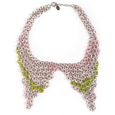 a close up of a necklace on a white background
