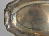 a silver tray that is sitting on a white surface