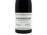 a bottle of wine that is sitting on a table