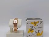 a small box with a watch on it next to a small box with a watch on it