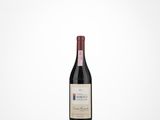 a bottle of red wine sitting on top of a table