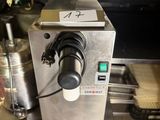 a machine that is sitting on a counter in a kitchen