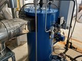 a large blue machine that is inside of a building