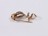 a small piece of jewelry that is laying on a table
