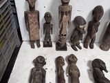 a lot of wooden figurines sitting on a table
