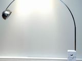 a lamp that is on the floor next to a box