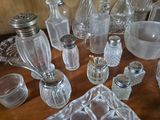 a table with a lot of glass items on it
