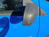 a close up of a blue car door handle
