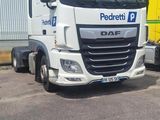 two trucks parked next to each other in a parking lot
