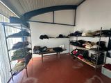 a room that has a lot of clothes on the shelves
