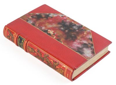 un livre rouge sur lequel figure l'image d'une fleur