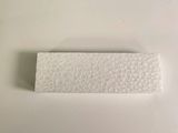 a white piece of paper on a white surface