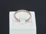a close up of a ring in a white box on a black background