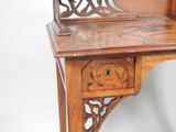 a small wooden desk with a drawer underneath it
