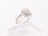 a diamond ring on a clear display case