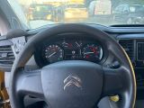 dashboard view of a car with a steering wheel and dashboard gauges