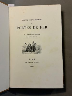 an open book with a picture of a group of people sitting on a bench