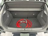 the trunk of a car with a hose in the trunk