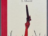 a book with a red cover sitting on top of a table